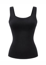 Top sculptant noir pour femme avec brassière intégrée et larges bretelles, vue de face sur fond blanc